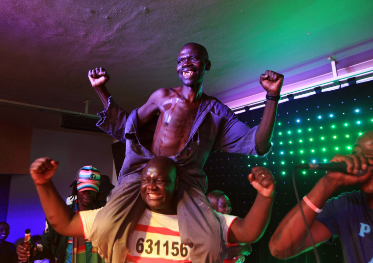 Image: Mison Sere reacts after winning the 2015 edition of the Mr Ugly competition