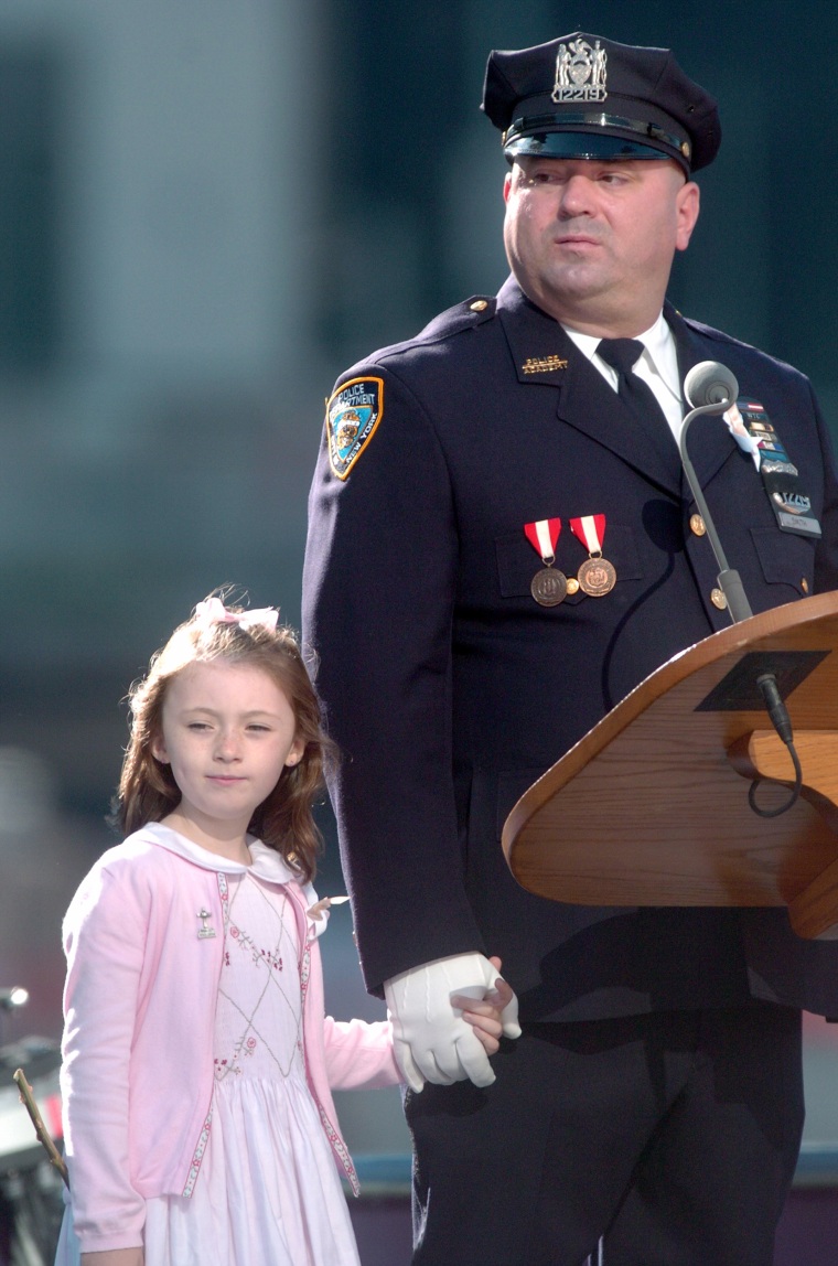 Patricia Mary Smith, 7, holds hands with her father