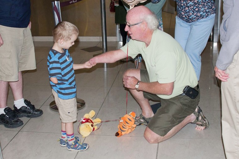 Adopted grandson and new grandfather bond over missing right hands