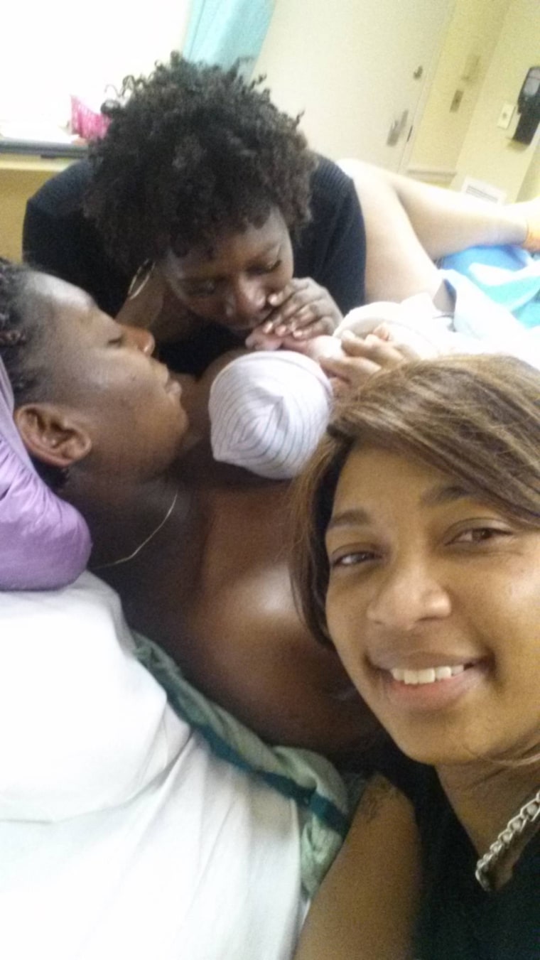 Collins introduces baby Tyler to her sisters, Shanell Brinkley-Chapman (front) and Madonna Baker (back.)