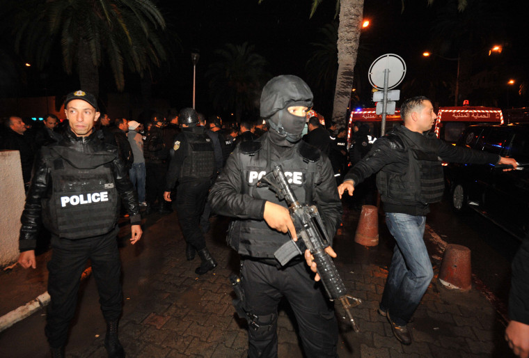 Image: Tunisian police block the road leading to the site of an explosion