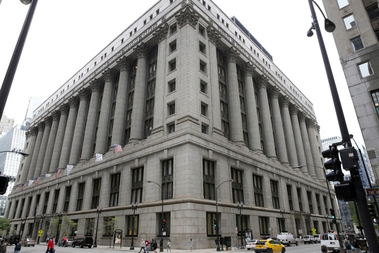 Image: Pedestrians walk by Chicago's City Hall