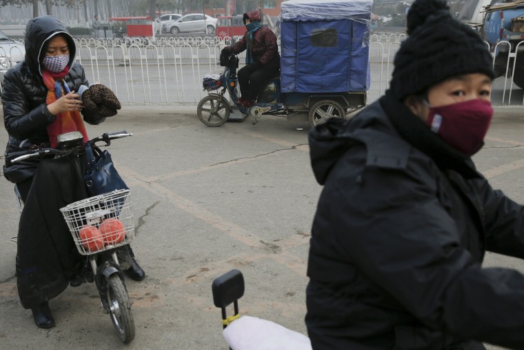 Image: Women wear protective masks in Baoding, China
