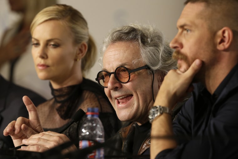 Director George Miller, center, speaks alongside Charlize Theron, left, and Tom Hardy during a press conference for the film Mad Max: Fury Road at the 68th international film festival, Cannes, southern France, Thursday, May 14, 2015.