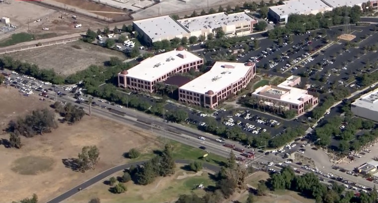 Firefighters set up a triage area near the Inland Regional Center on the South Waterman Avenue in San Bernardino, Calif.