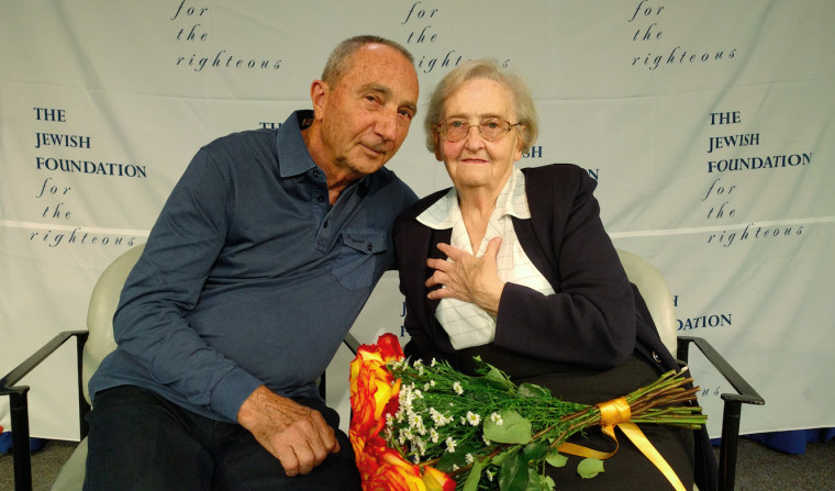 Michael Hochberg is reunited with Krystyna Jakubowska at John F. Kennedy Airport in New York. Jakubowska saved Hochberg's life during the Holocaust by pretending to be his big sister.