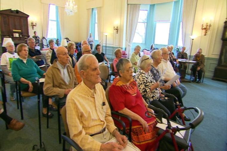 Judson Manor residents listen to a concert presented by students living at the residence.