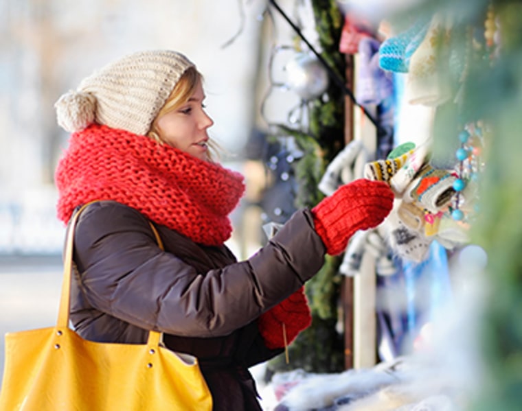 Outdoors portrait of young beautiful woman on a Christmas market; Shutterstock ID 336787001; PO: TODAY.COM