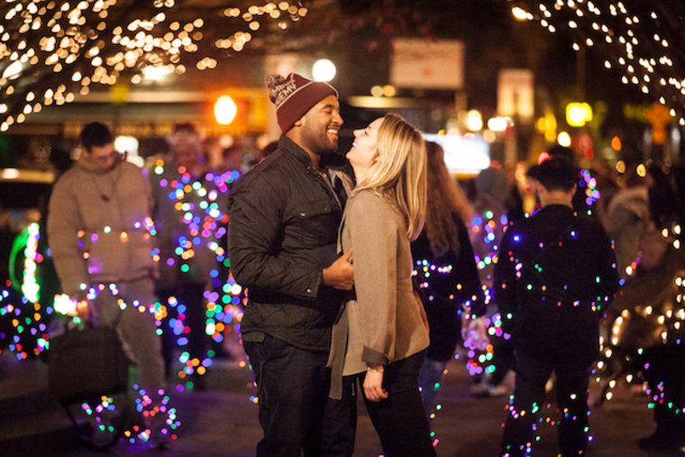 This couple appears to be surprised by Improv Everywhere's 2015 holiday stunt, "The Light Switch."