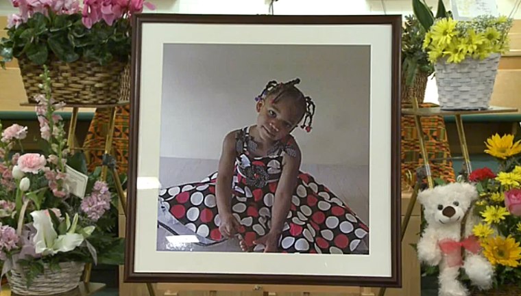 A photo of five-year-old Payton Benson is displayed at her funeral.