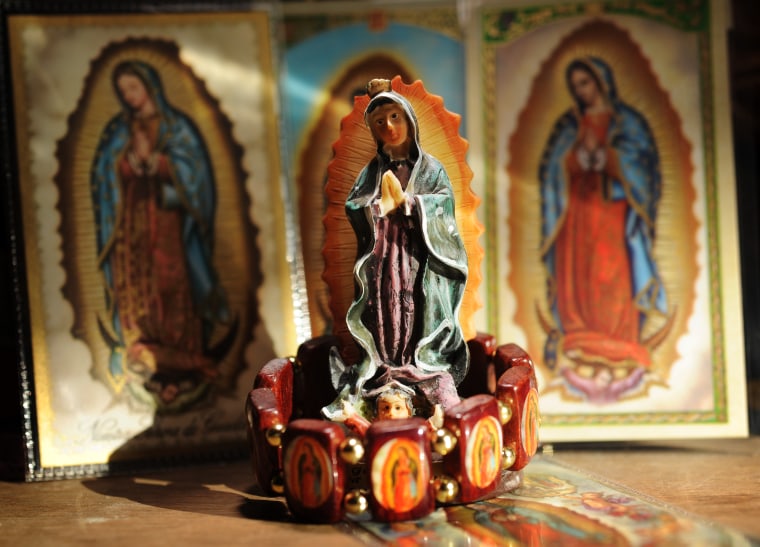 (CM) FE07CSCOVER_CM04 Cards, a bracelet and little statue of the Our Lady of Guadalupe at the Botanica Caridad Del Cobre store at 3501 Lawrence Street in Denver on Monday, December 1, 2008. Cyrus McCrimmon, The Denver Post