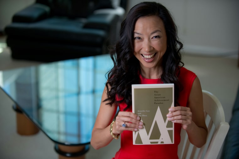 UC Irvine professor Jennifer Lee with a copy of "The Asian American Achievement Paradox," which she co-wrote with UCLA professor Min Zhou