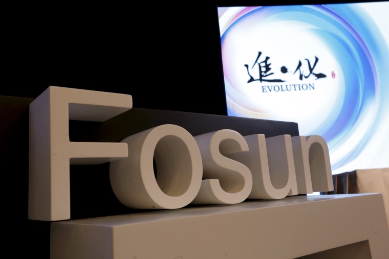 Image: File photo of a company logo of Fosun International at the annual general meeting of the Chinese conglomerate in Hong Kong