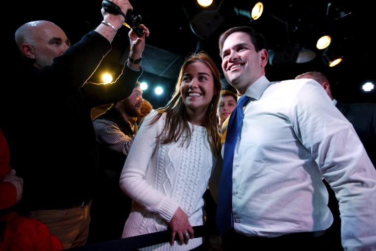 Image: Republican presidential candidate Senator Marco Rubio (R-Fla.) takes a photo with Iowa State University student Kelsi Wolever, 21, after speaking at a campaign event at the Maintenance Shop at Iowa State University in Ames