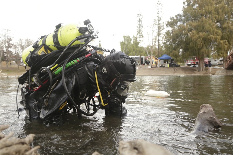 Image: An FBI diver searches the water at Seccombe Lake Park after a shooting earlier this month in San Bernardino, California