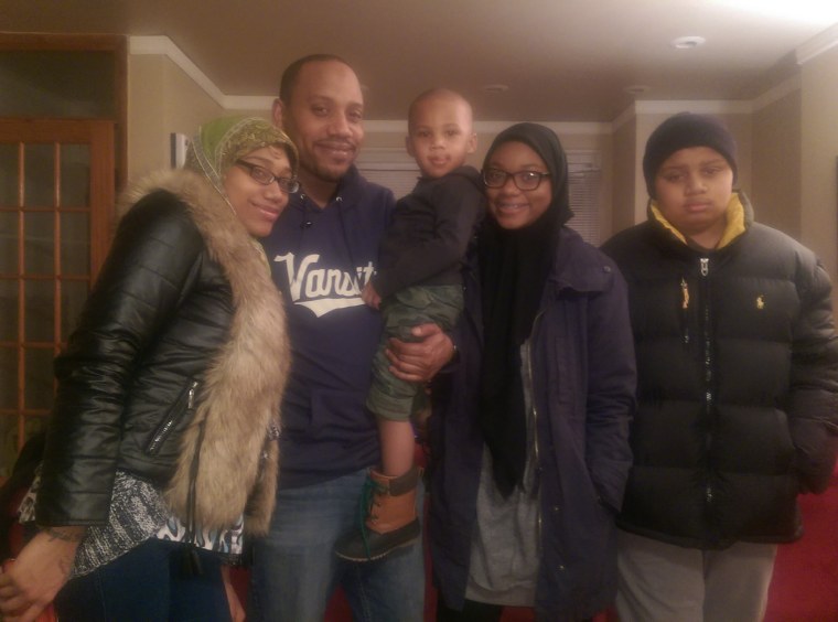 Jihad Ahmed with four of his eight kids: (left to right) Ahmed's daughter Ahmed (20), son Suhayb (3), daughter Ameenah (17), and son Aqil (15).