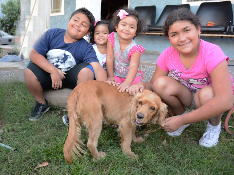 The Ortiz kids with their dog, Dodger