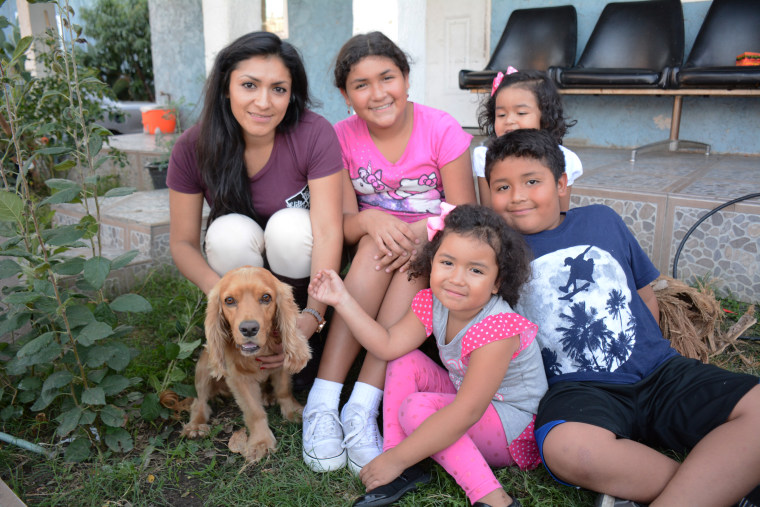Jeanette Ortiz and her kids with Dodger the dog