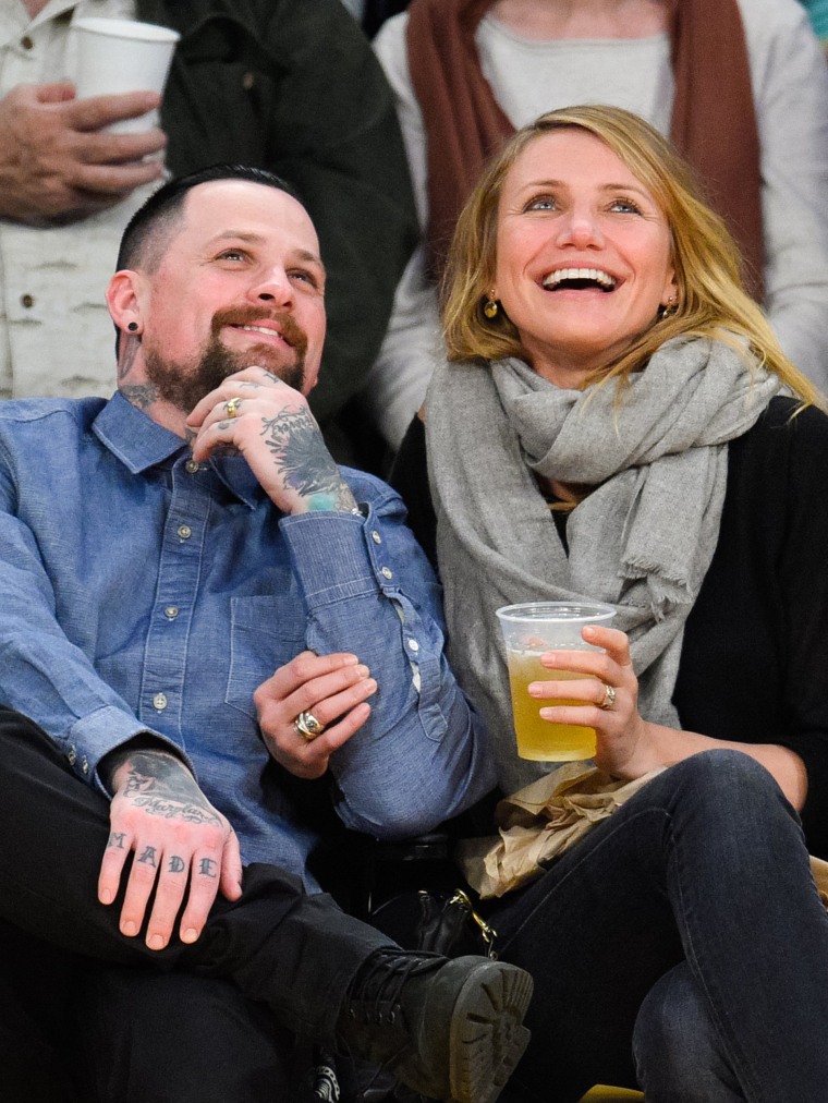 Benji Madden and Cameron Diaz attend a basketball game between the Washington Wizards and the Los Angeles Lakers