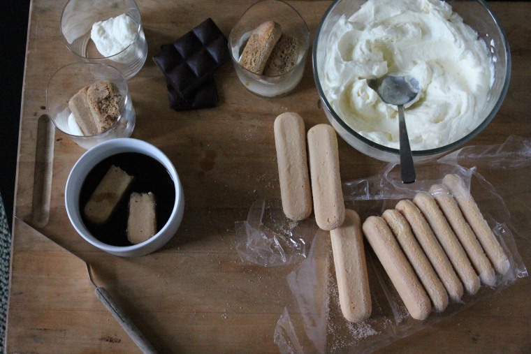 Tiramisu Parfaits step-by-step: Spoon the mascarpone mixture into a glass, then add an espresso-soaked ladyfinger