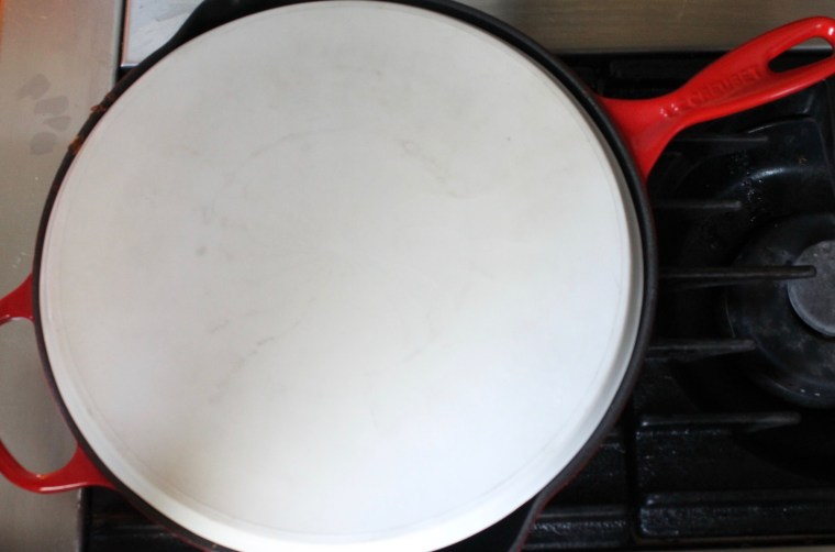 Crispy Rösti Potatoes with Oven-Poached Eggs: Invert a large plate on top and grabbing both the skillet and plate with oven mitts, turn the potato cake onto the plate.