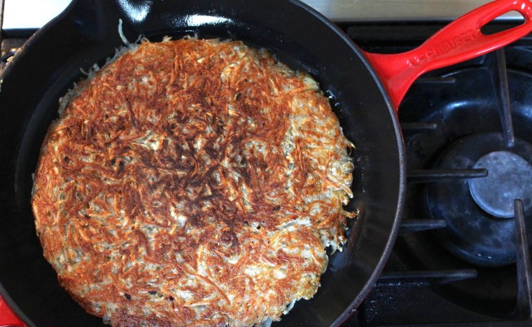 Crispy Rösti Potatoes with Oven-Poached Eggs: Cook over moderately–low heat until golden and crisp, about 15 minutes longer