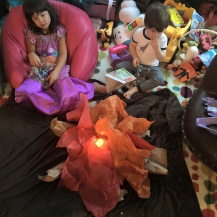 Angie Goff's kids enjoy a make-believe campfire at home.