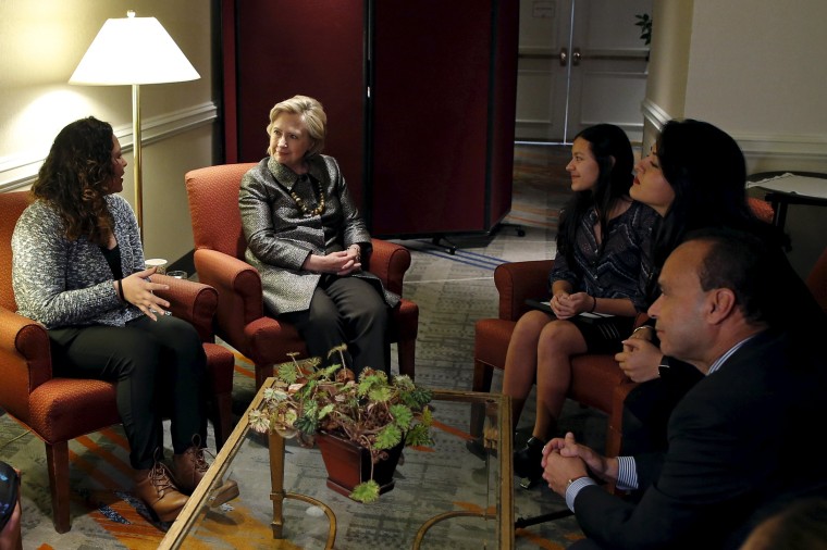 Image: Democratic U.S. presidential candidate Hillary Clinton meets with mixed status immigrant family before addressing the 2015 National Immigrant Integration Conference in New York