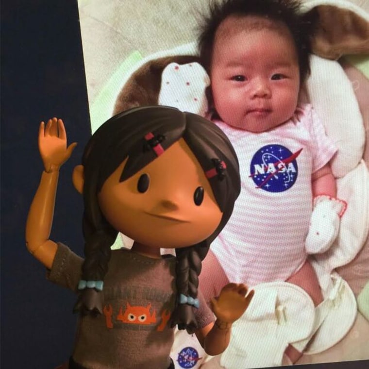 Yuna doll with Yuna the baby, a newborn whose father works at NASA.