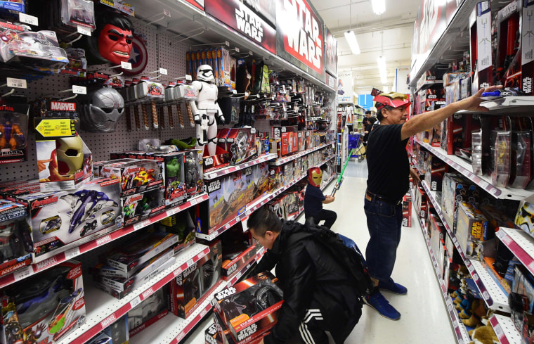 Image: People shop for items at a store selling Star Wars merchandise