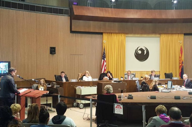 Activists from the One Phx ID coalition attending the Phoenix City Council vote on Wednesday, Dec. 16, 2015, to support a proposal for a city photo ID and service card.