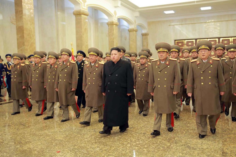 Image: North Korean leader Kim Jong-Un is accompanied by commanding officers of the Korean People's Army