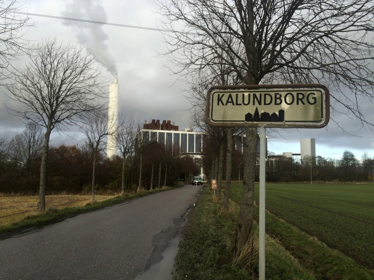 Image: A car drives in front of DONG Energy's power station in Kalundborg