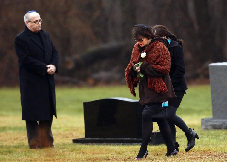Image: Veronique Pozner, mother of Sandy Hook Elementary School shooting victim Noah Pozner, arrives at his gravesite for his burial at the B'nai Israel Cemetery in Monroe, Connecticut