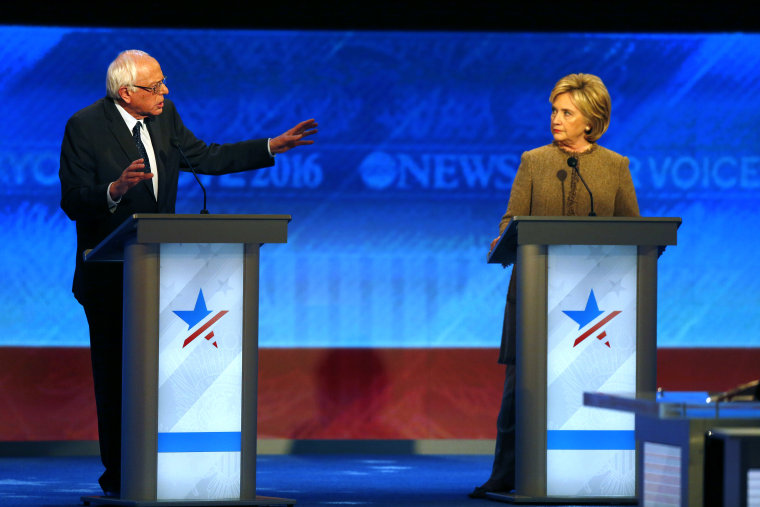 Bernie Sanders, left, offers an apology to Hillary Clinton during a Democratic presidential primary debate Saturday, Dec. 19, 2015, at Saint Anselm College in Manchester, N.H. (AP Photo/Jim Cole)
