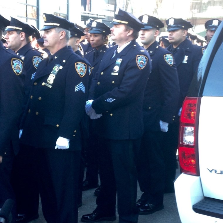 Police officers at a ceremony Dec. 20, 2015, unveiling plaques honoring Wenjian Liu and Rafael Ramos, two NYPD officers slain in the line of duty in 2014.