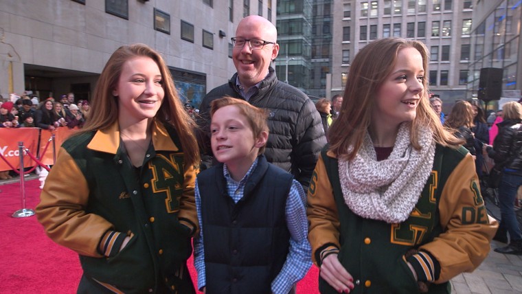 Tom Hoban with his children, Meghan, T.J. and Katie, on the plaza.