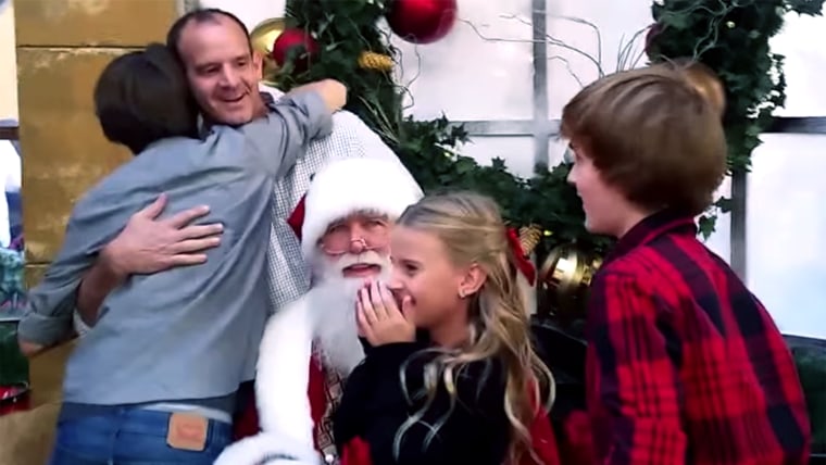 Surprise homecoming while kids visit Santa