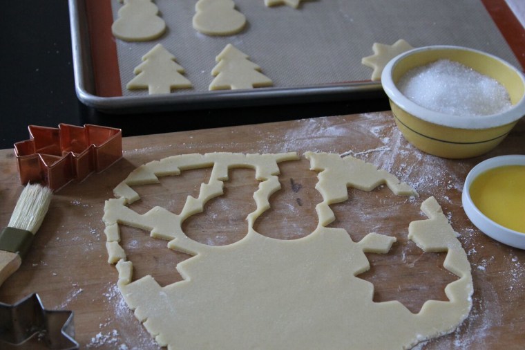 How to Make Sugar Cookies: Stamp out as many cookies as possible from the dough