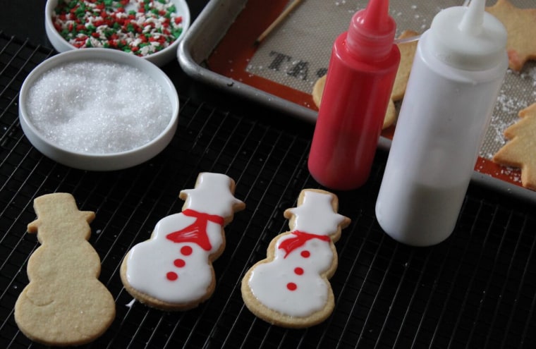 How to Decorate Sugar Cookies: Spread the white glaze to cover the cookies and let dry completely