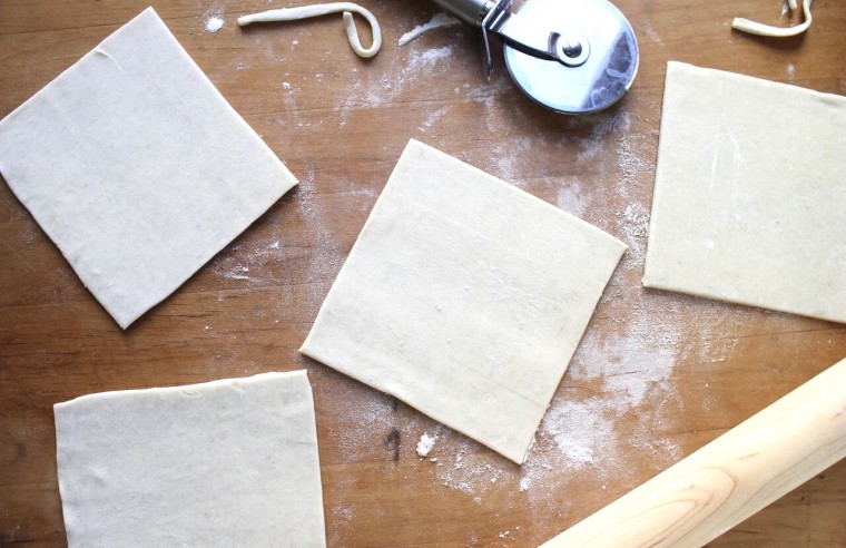 How to Make Sausage Puffs: Cut puff puff pastry into four 6-inch squares