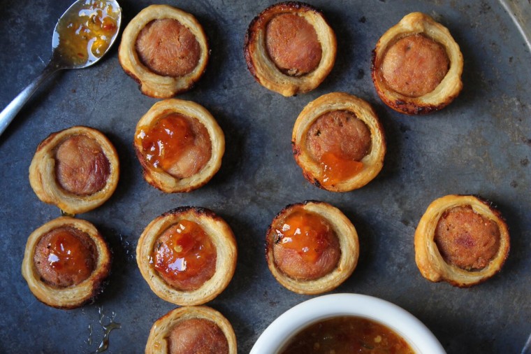 How to Make Sausage Puffs: Spoon a dollop of spicy sauce onto each slice