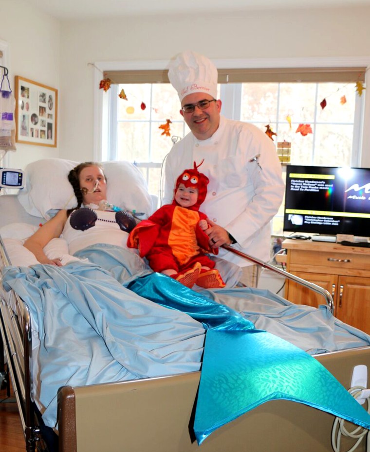 Amanda Bernier and her husband, Chris, with their daughter, Arabella