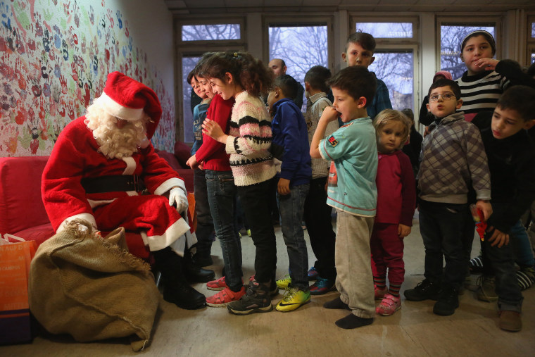 Image: BESTPIX Santa Claus Visits Migrants Shelter