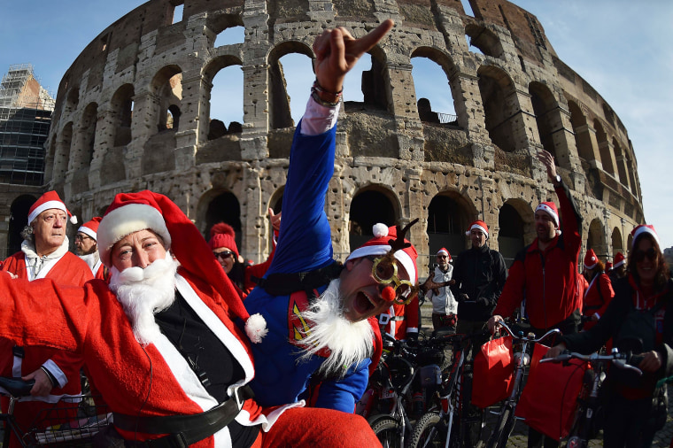 Image: TOPSHOT-ITALY-SANTA CLAUS-RALLY-CHRISTMAS