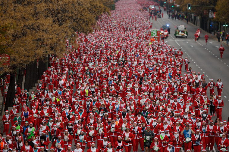 Image: *** BESTPIX *** Thousands Dressed As Santa Claus Run In Madrid