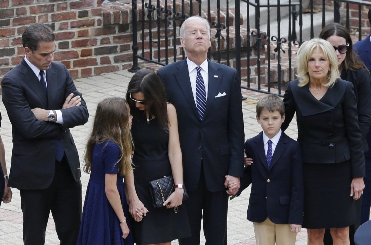 Image: Vice President Joe Biden, center, pauses alongside his family as they to enter a visitation for his son