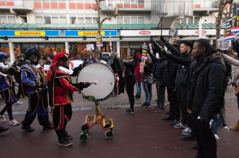 Protestors including Zwarte Piet Is Racisme project co-founder, Jerry Afriyie briefly brought the November Sinterklaas arrival parade to a halt by blocking the path of men dressed as Black Pete. 