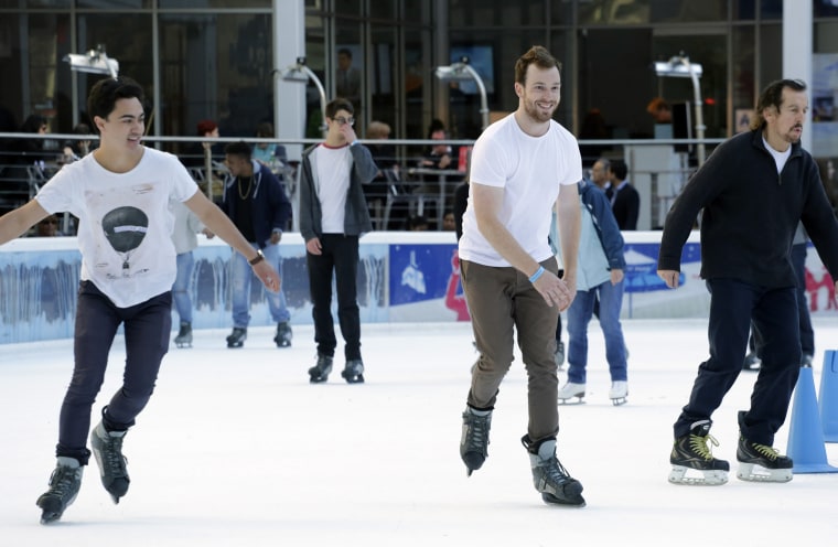 Men in short sleeves skate around the ice rink in Bryant Park on Dec. 15, 2015, in New York as the region experienced unseasonably warm weather.