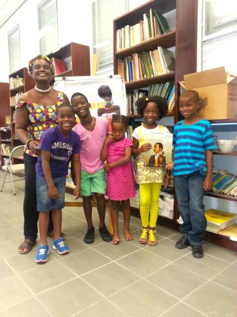 Instructor Sheila Payne and a group of young models during a 2014 African heritage education session